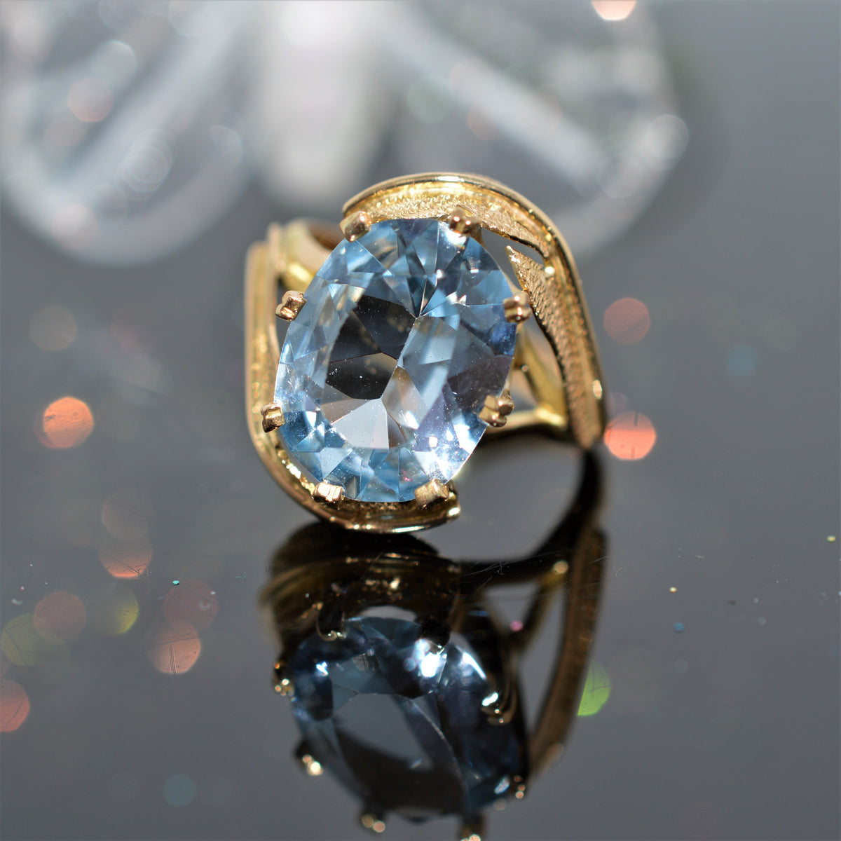 14K Yellow Gold Oval Cut Blue Topaz Leaf Design Ring