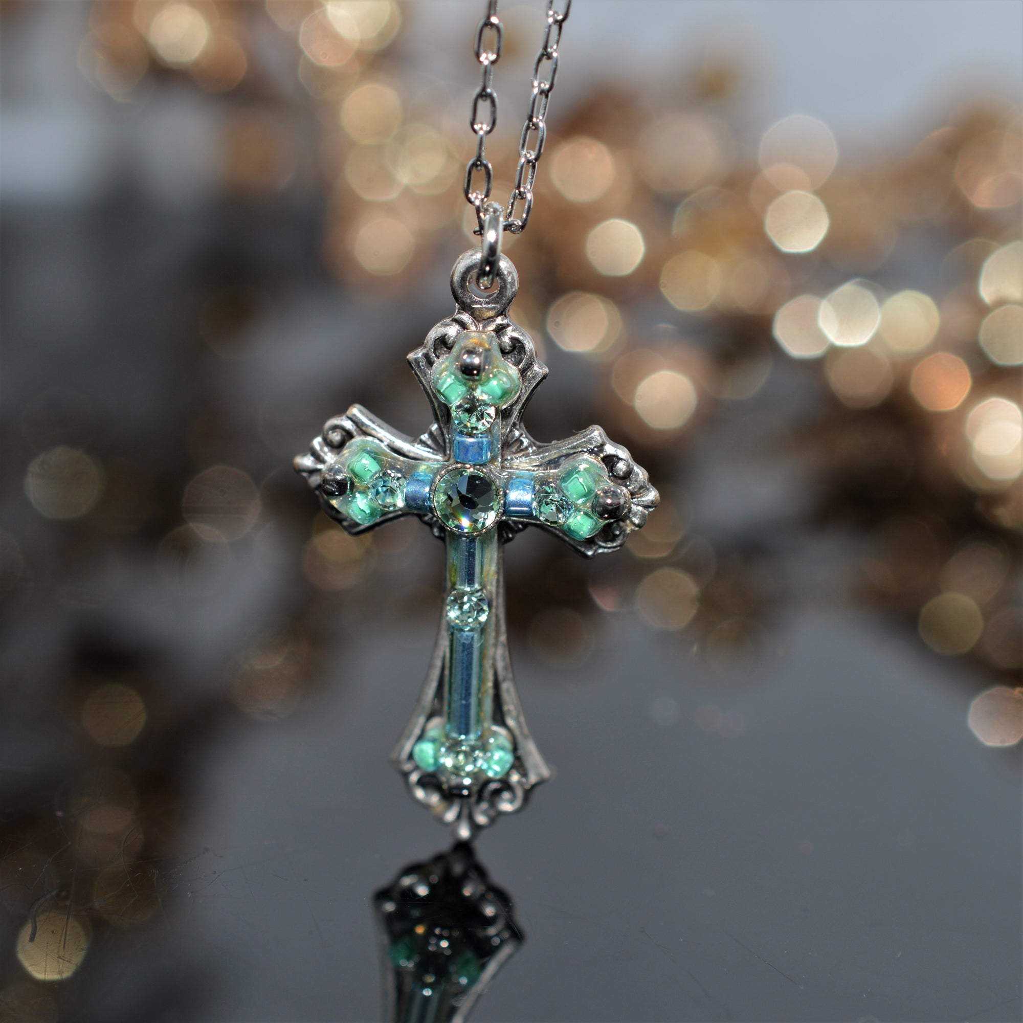 Antique Silver Plated Cross Pendant With Aquamarine Colored Crystals by Firefly