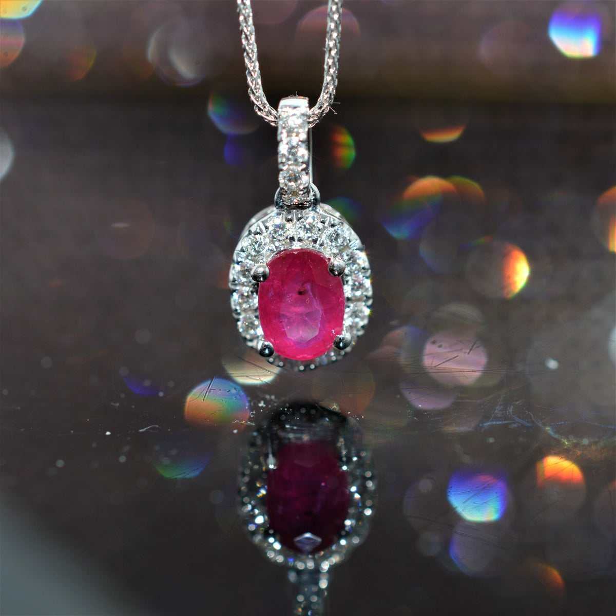 14K White Gold Oval Ruby And Diamond Halo Pendant