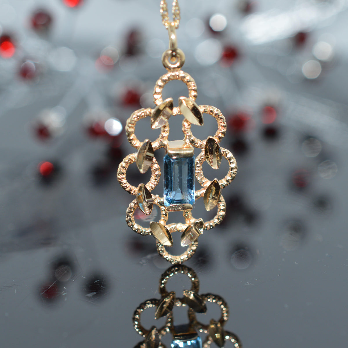 14K Yellow Gold Diamond Cut Pendant With Blue Topaz And Chain