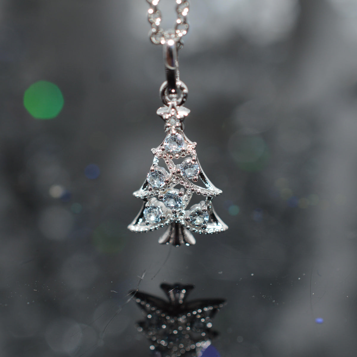 Sterling Silver Chain With Christmas Tree Pendant Set With Topaz Gemstones
