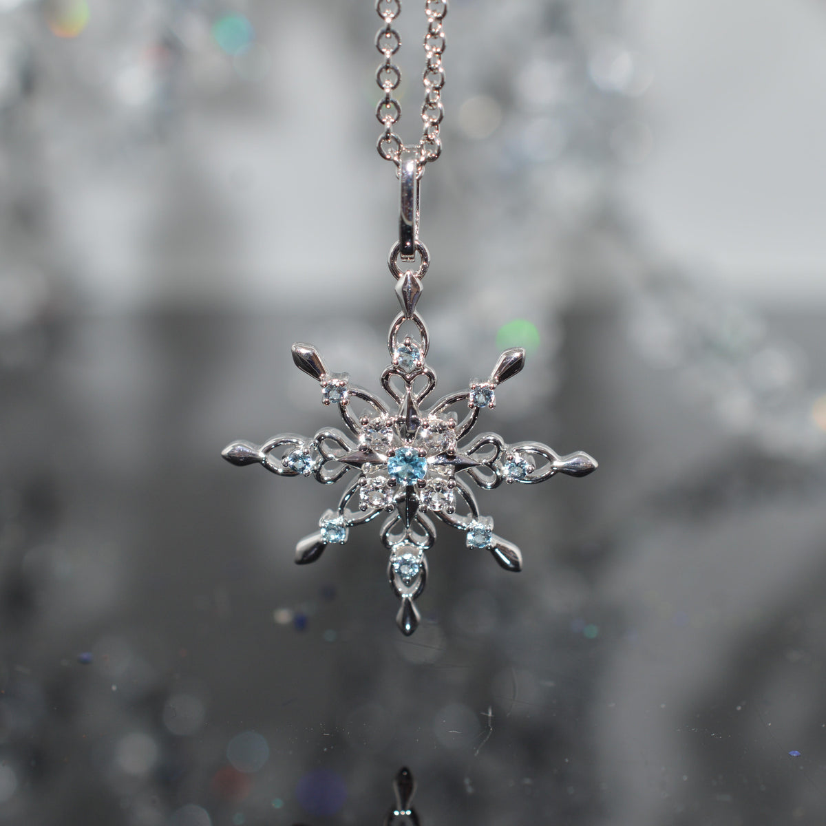 Sterling Silver Chain With Snowflake Pendant Set With Topaz Gemstones