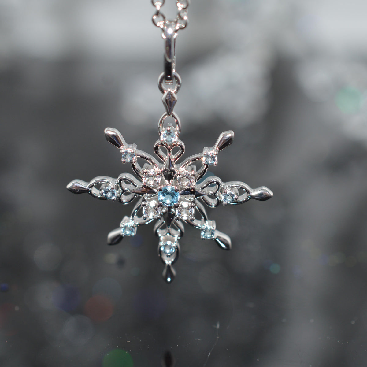 Sterling Silver Chain With Snowflake Pendant Set With Topaz Gemstones