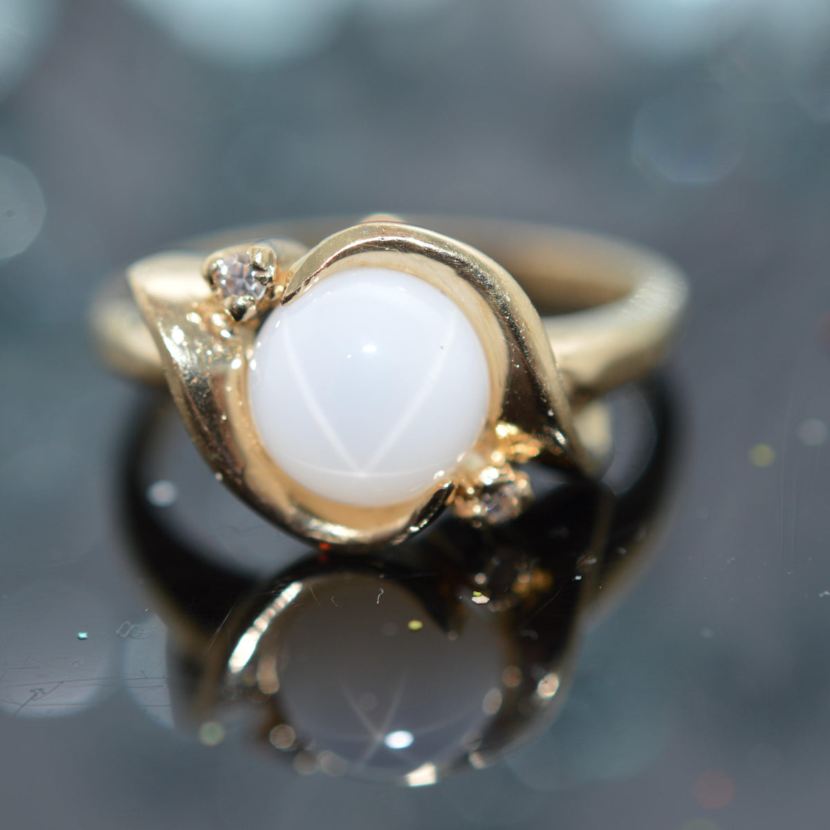14K Yellow Gold Round White Synthetic Star Sapphire Ring With 2 Diamonds