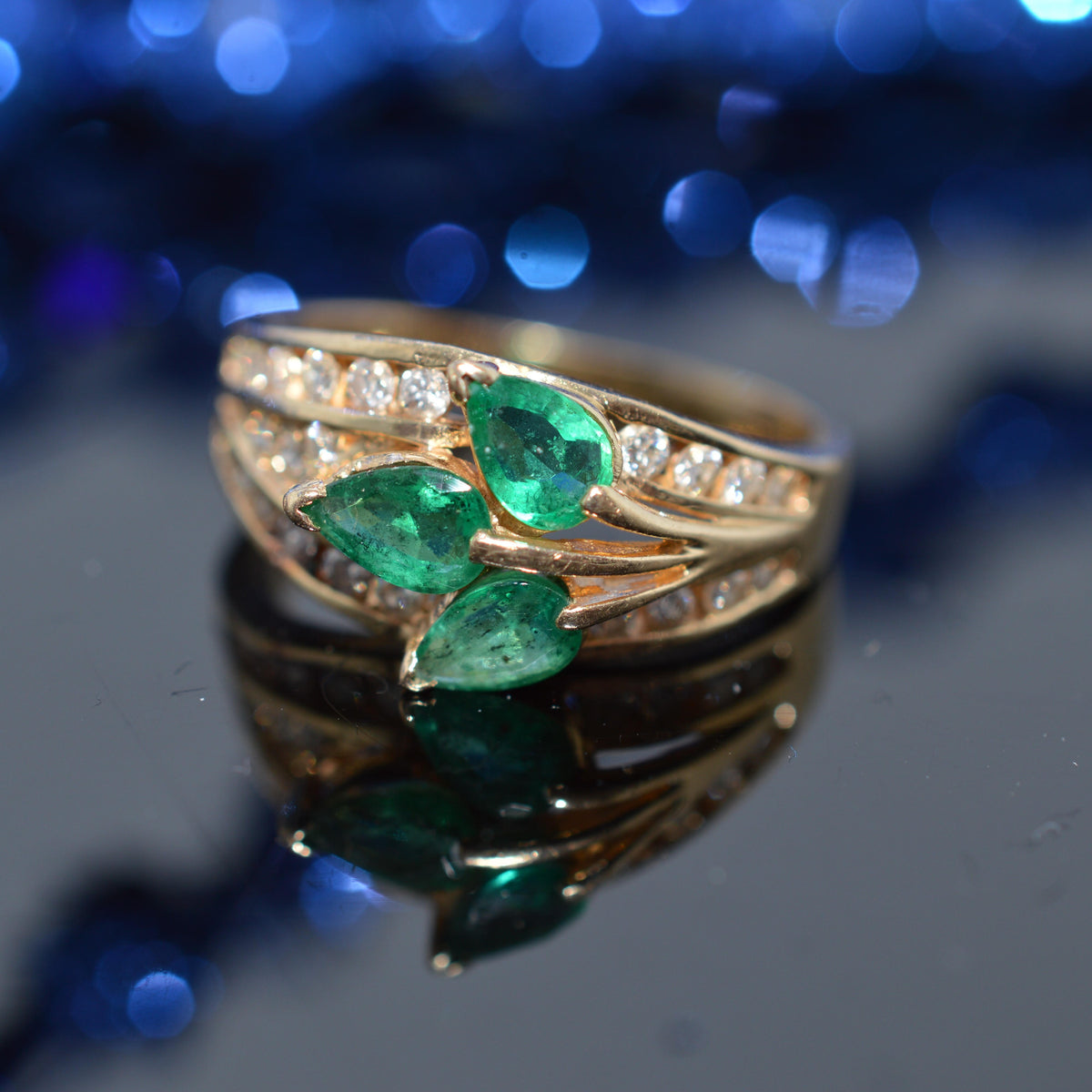 14K Yellow Gold Diamond Ring With 3 Pear Cut Emeralds