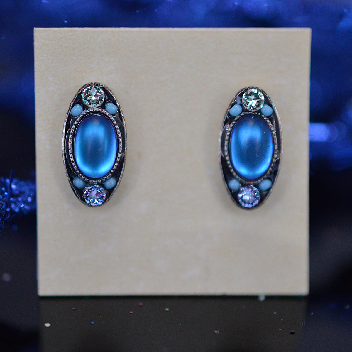Antique Silver Plated oval Stud Earrings With Light Blue Moonlight Crystals by Firefly