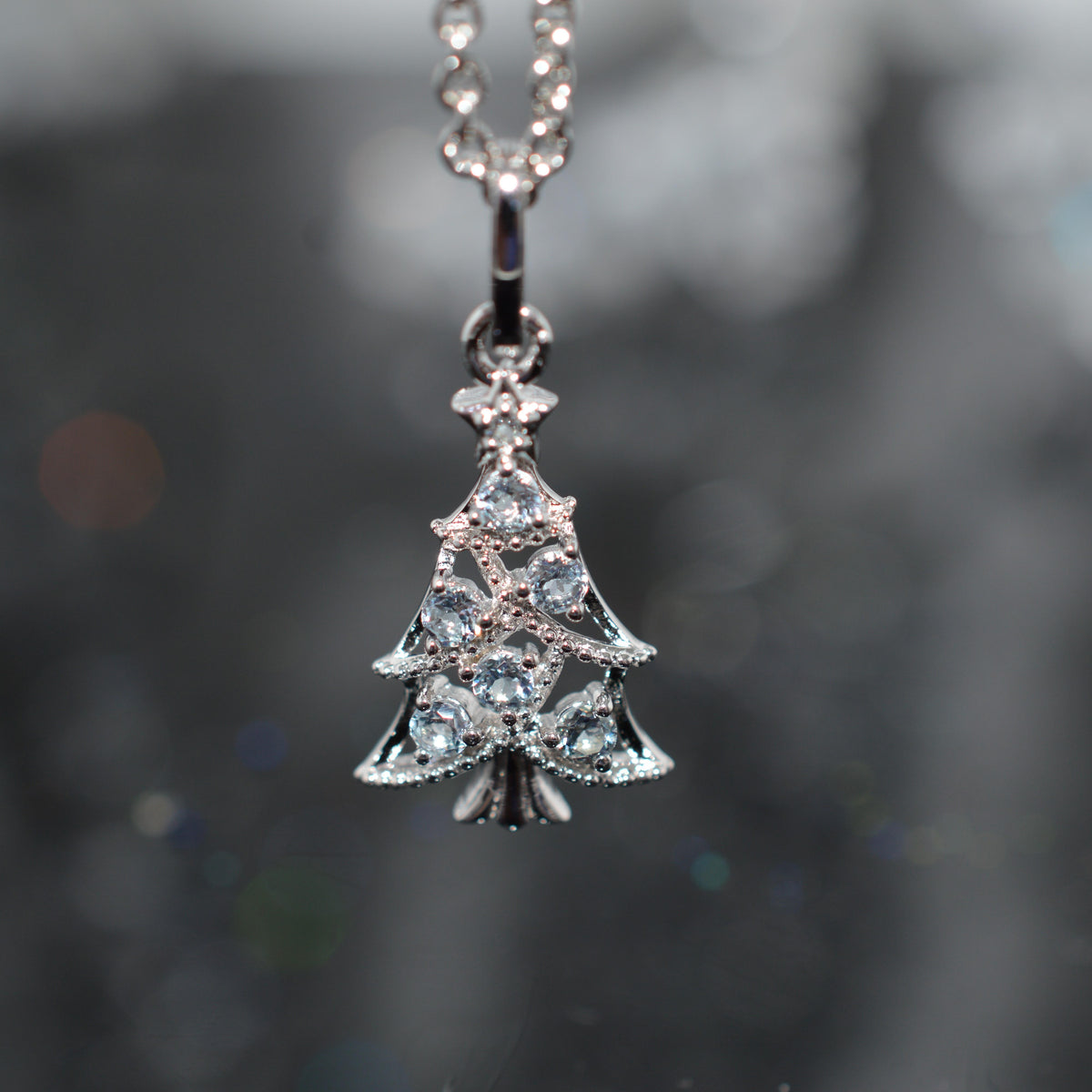 Sterling Silver Chain With Christmas Tree Pendant Set With Topaz Gemstones