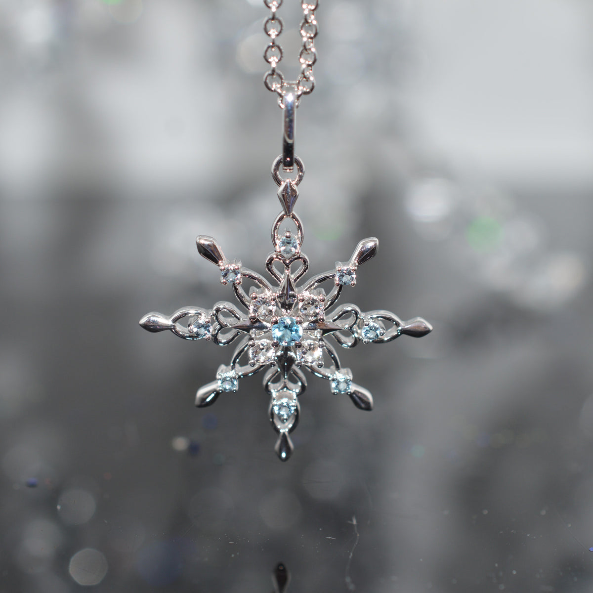 Sterling Silver Chain With Snowflake Pendant Set With Topaz Gemstones