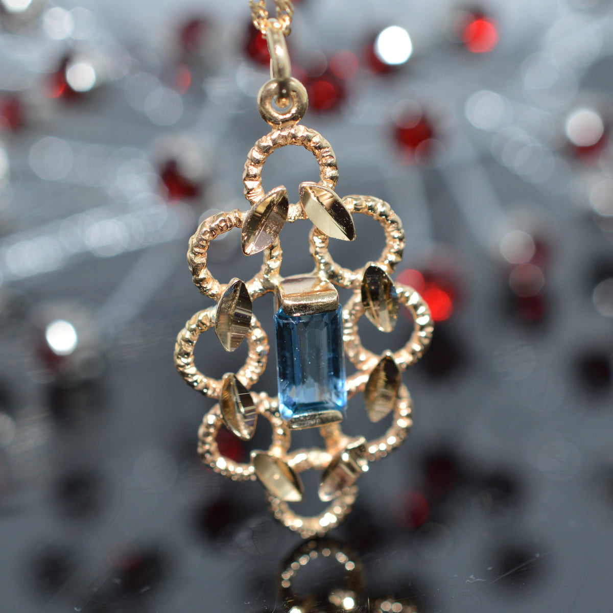 14K Yellow Gold Diamond Cut Pendant With Blue Topaz And Chain