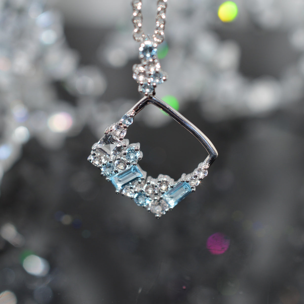 Sterling Silver Chain With Square Confetti Pendant Set With White & Blue Topaz Gemstones