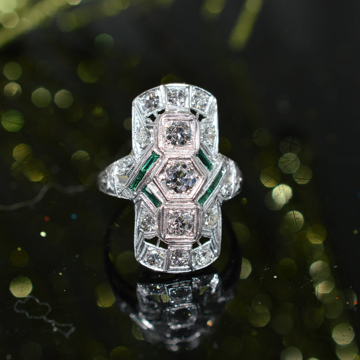 Platinum Antique 1 Carat Total Weight Diamond Ring With Synthetic Green Emeralds