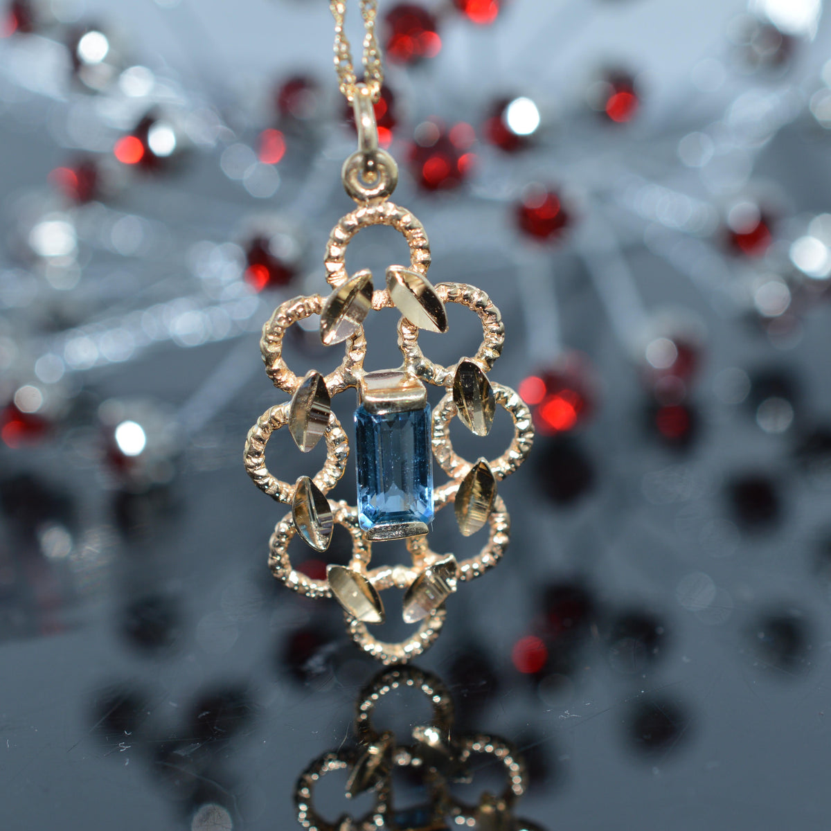 14K Yellow Gold Diamond Cut Pendant With Blue Topaz And Chain