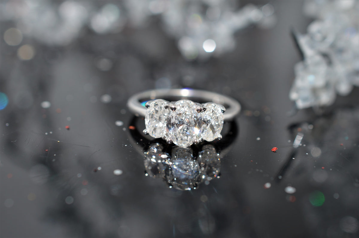 14 Karat White Gold, Three Stone Oval Diamond Ring