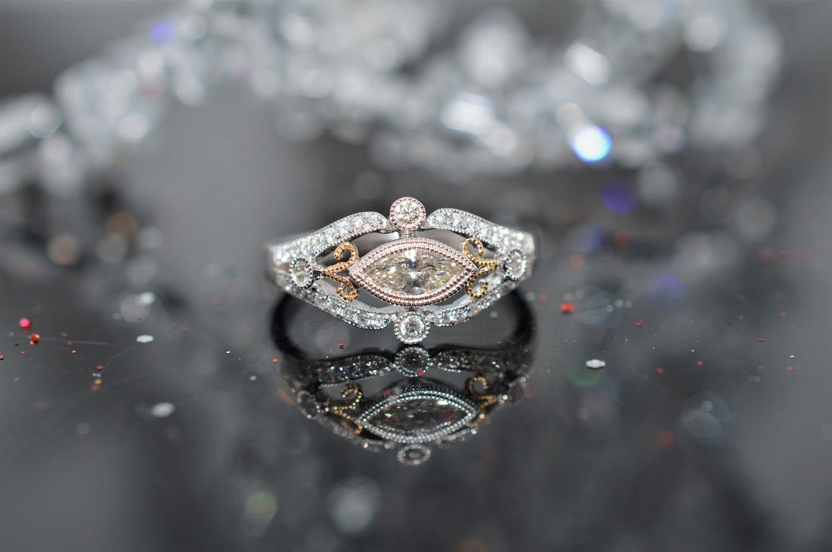 Two Toned Marquise Diamond Scroll Design Engagement Ring
