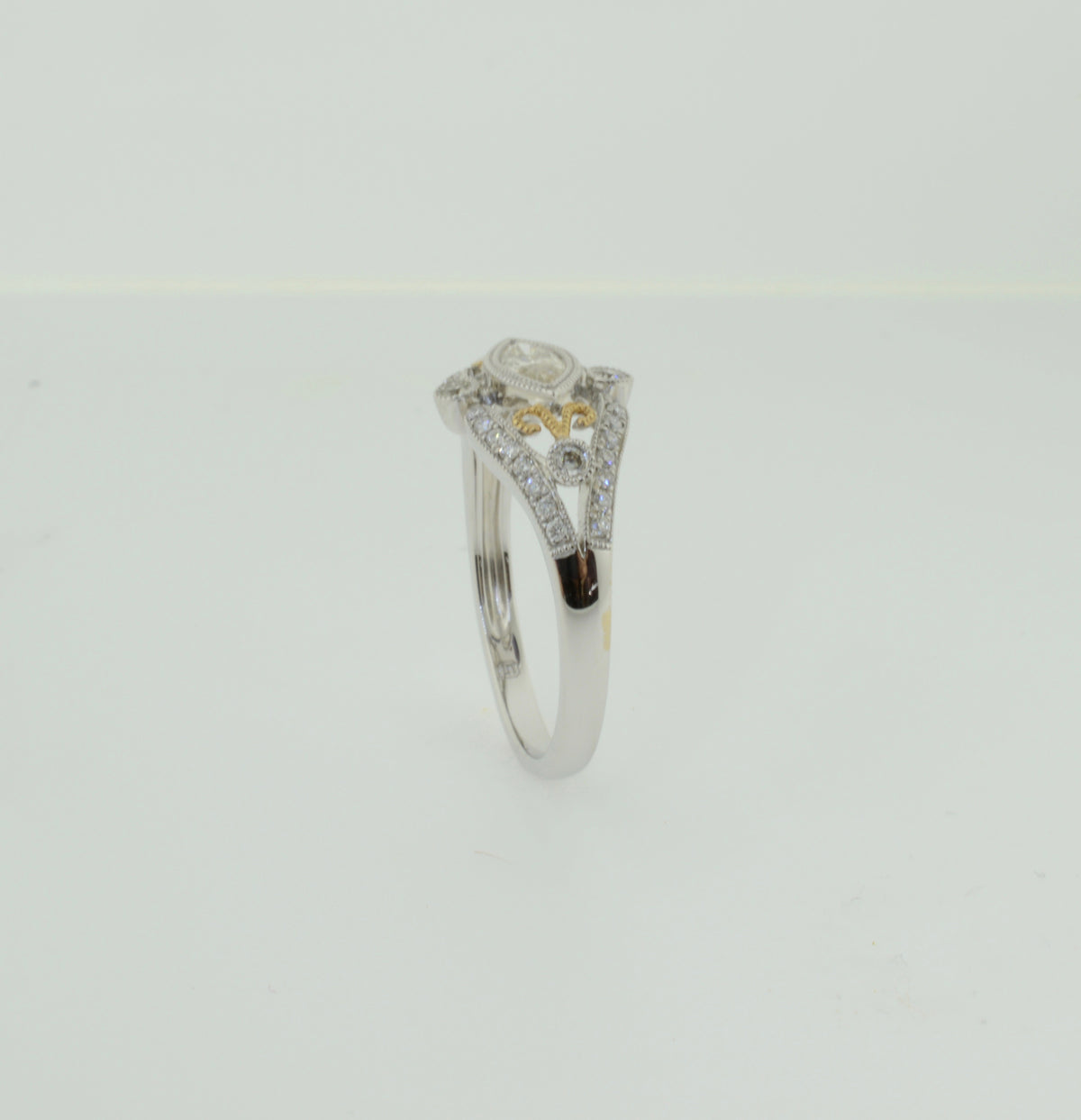 Two Toned Marquise Diamond Scroll Design Engagement Ring
