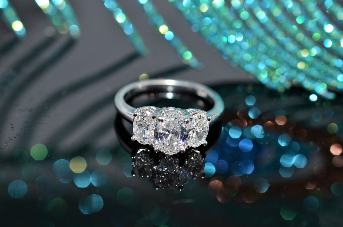 14 Karat White Gold, Three Stone Oval Diamond Ring